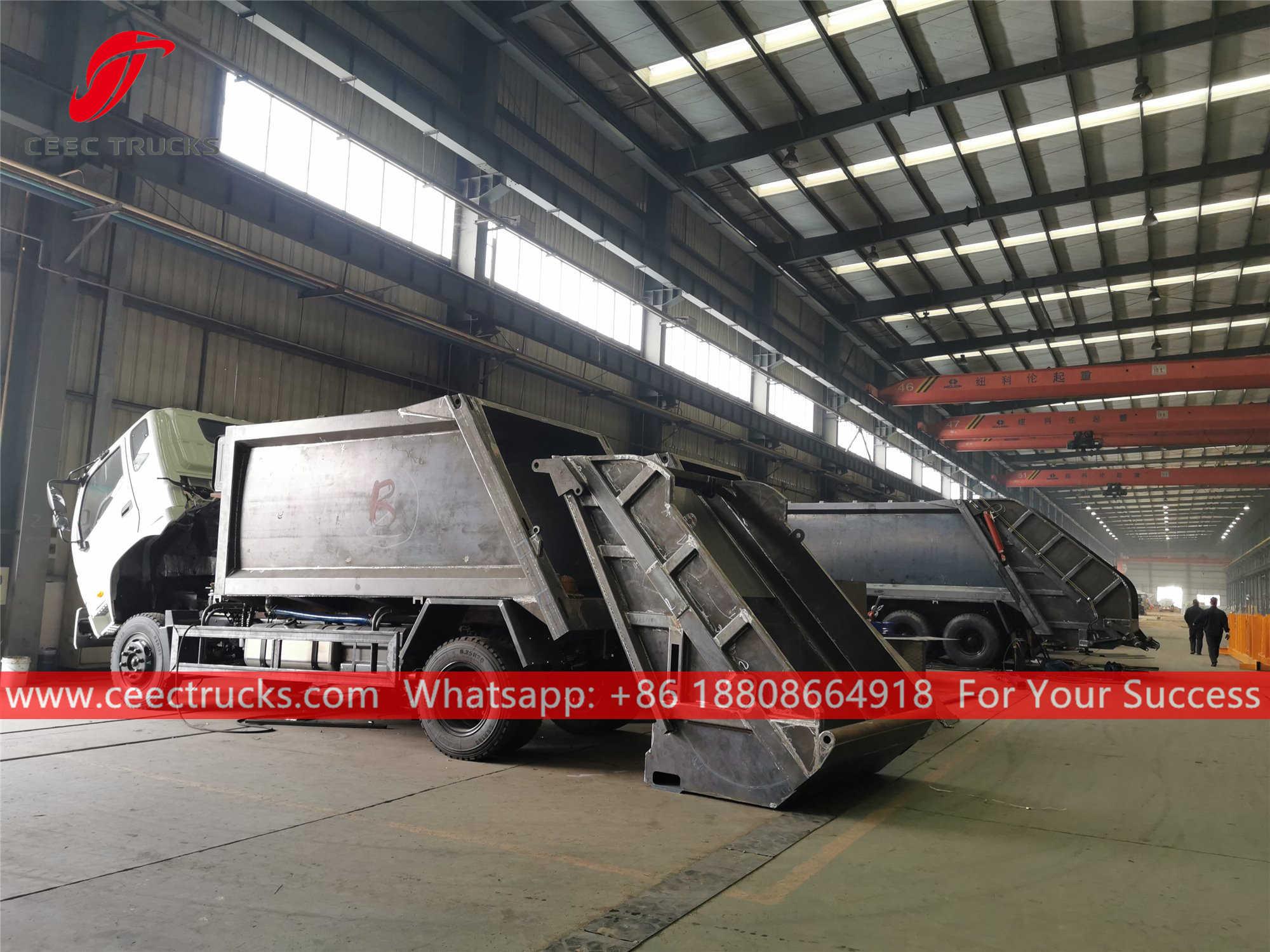 Compressed garbage truck during production Compressed garbage truck during production